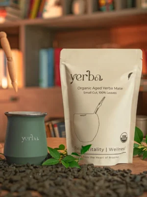 Yerba organic maté pouch beside a green stainless steel gourd