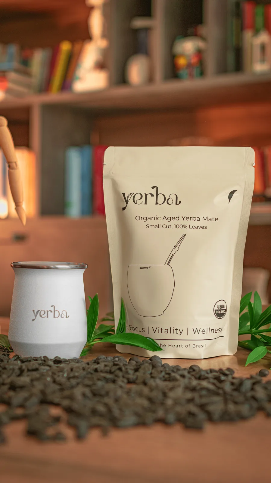 Yerba organic maté pouch beside a white stainless steel gourd