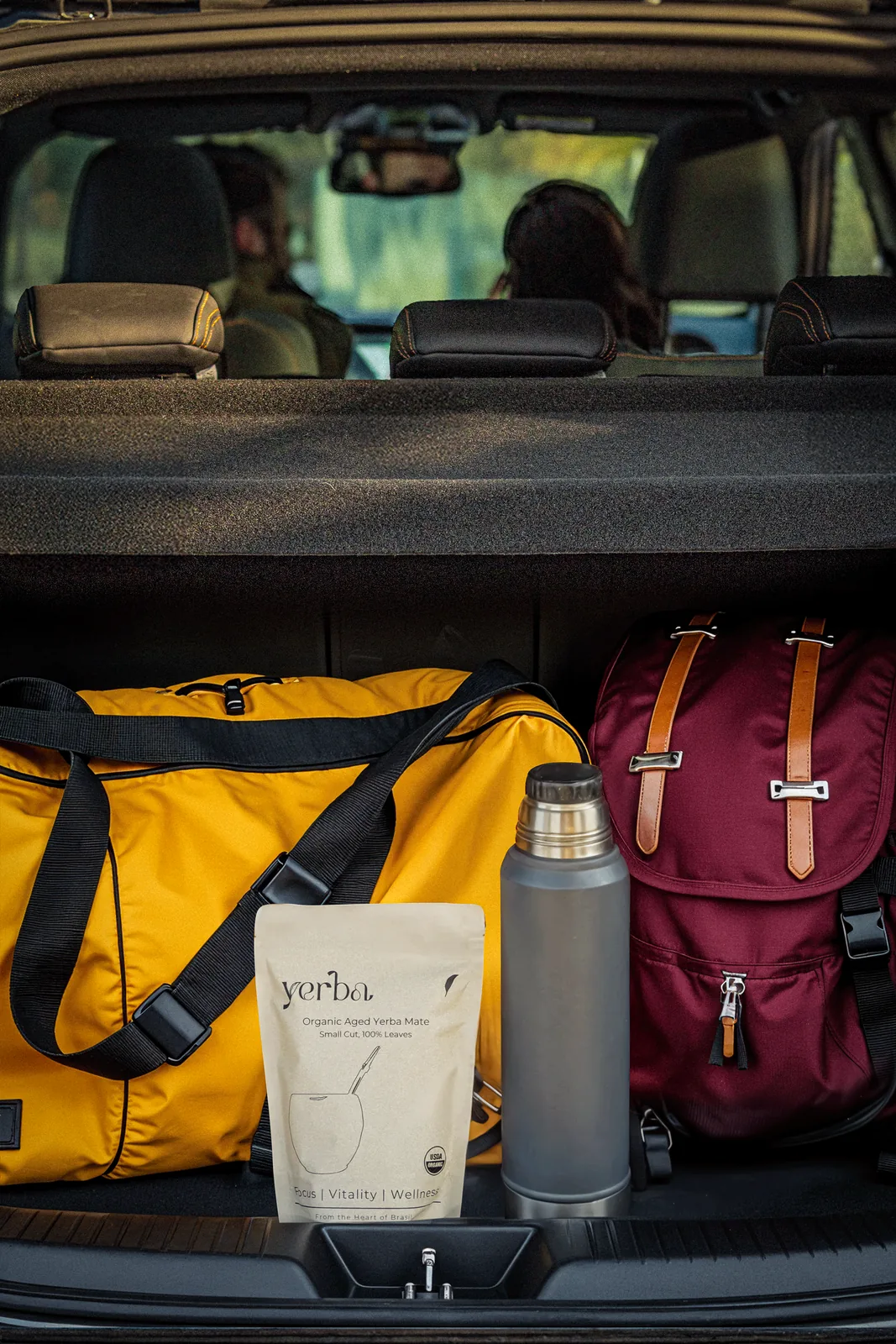 Yerba thermos and mate pouch packed in the boot of a car
